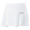 A girl wearing a white basic club skort for sports or casual wear.