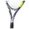 Image of a tennis player serving the ball with intense focus and determination