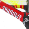 Green and blue tennis racket with black handle.