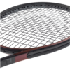 A close-up of a tennis racket with strings and grip visible