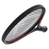 A close-up view of a high-quality badminton racket held by a person, showcasing its sleek design and precision craftsmanship.
